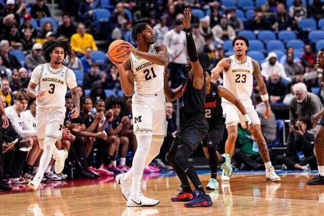 No. 1 Michigan outshoots Howard in high-scoring win