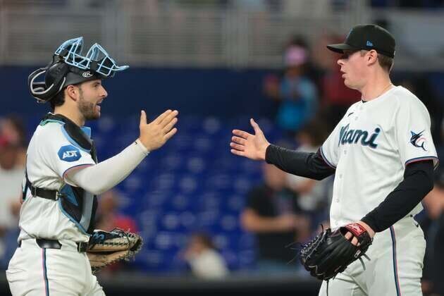 Colorful backdrop to hot Marlins welcoming Rangers, Scottish fans, dogs