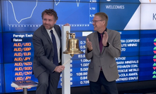  Sam Spring (left) rings the bell for Kincora's ASX listing