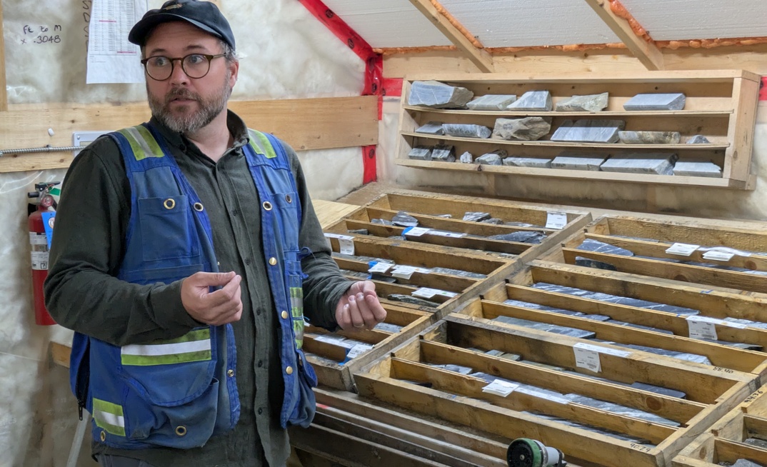 Banyan Gold VP exploration Duncan Mackay talknig high grade drill core at Aurmac in Yukon, Canada