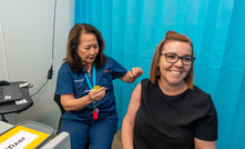 A BHP worker in Queensland being vaccinated