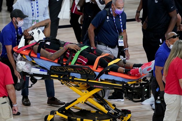 Heat F Jones stretchered off with apparent neck injury