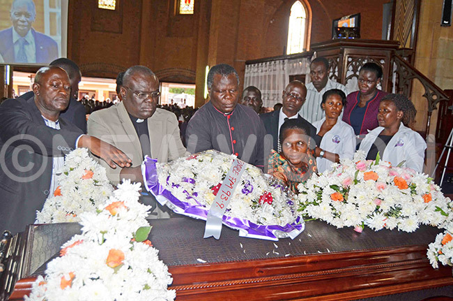  he managers and staff of amirembe  laying a wreath on the casket bearing the remains of anon jagala during the funeral service at amirembe athedral on onday