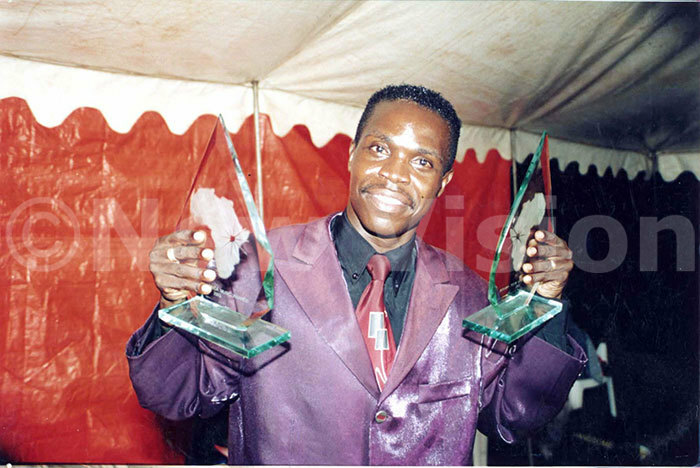 6  astor oerge kudi with his awards 2003