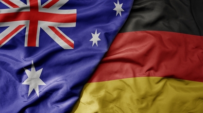 big waving realistic national colorful flag of australia and national flag of germany. Credit: Esfera.