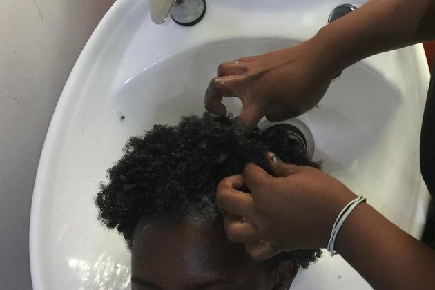 Women in Cameroon go back to their roots with natural Afro hairstyles