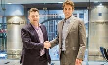 Downer chief executive Grant Fenn and Microsoft Australia managing director Steven Worrall shake on the deal.