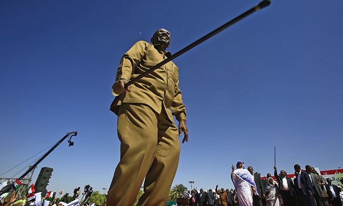 Three dead after Sudan protest as crowds cheer Bashir at rival rally Three dead after Sudan protest as crowds cheer Bashir at rival rally