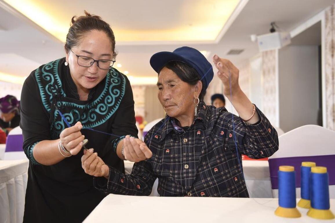 From China's mountain heartlands to global spotlight, Yi embroidery travels far