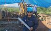 A PAM geologist with core from Reung Kiet 