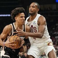 Hawks clinch playoff spot while walloping Cavs