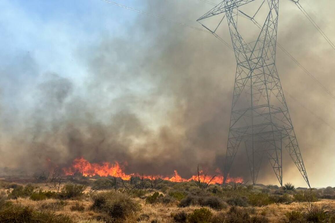 Crews battling wind-driven fire in Southern California's high desert make progress