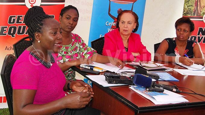   women epresentative gnes isembo irector of programmes  uliet akato doi mbassador  5 agie igozi and xecutive irector   atricia unabi addressing journalists during the press conference at  offices