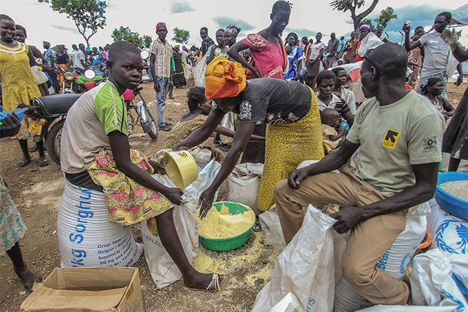 efugees receive monthly grain rations at the idi idi ettlement amp orth ganda  hoto