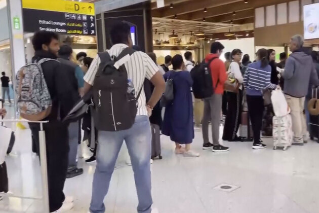 Passengers stranded at Abu Dhabi Airport following flight cancellations amid escalating tensions in Middle East