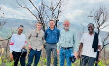  Chrisjan Van Wyk (middle) visiting the Epanko graphite deposit with Ecograf executives.