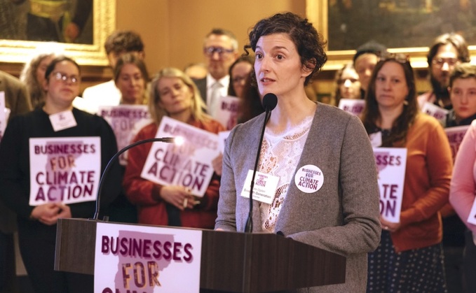 Kate Ogden, head of advocacy and movement building at Seventh Generation, addresses the media during the Businesses for Climate Action Lobby Day in the Vermont State House. Source: Patrick McCormack/Courtesy of SunCommon