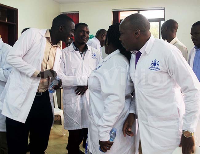  embers of the harmaceutical ociety of ganda  interacting after a press conference hoto by uliet aiswa