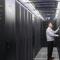 Data center engineers working silently behind booming AI services