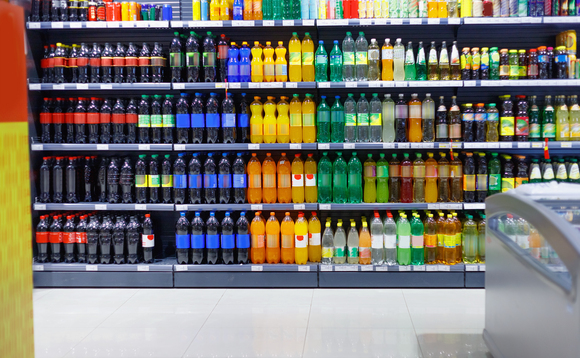 Supermarket shelves stocked with beverages | Credit: iStock
