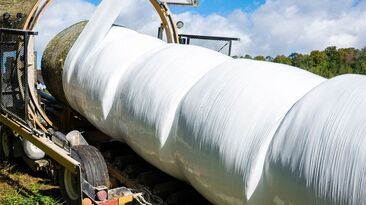 A farm operator has been charged after a worker was killed while operating a bale wrapper.