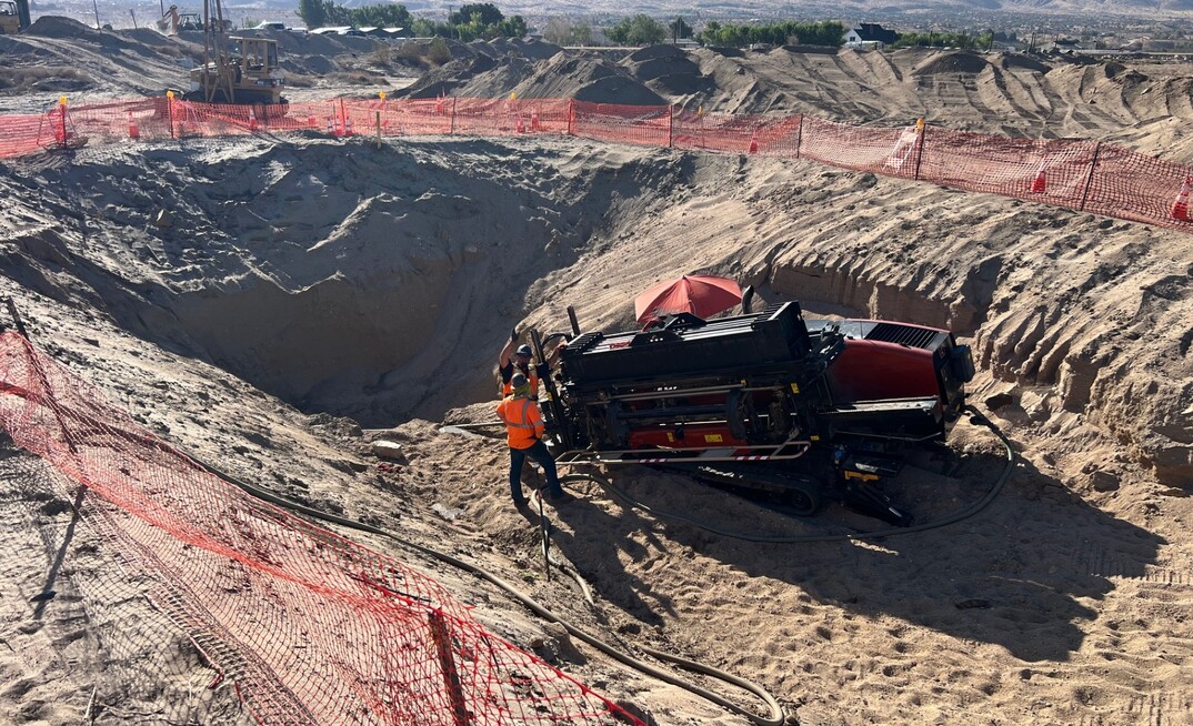 A 10ft by 10ft entry pit with a 2% grade down was dug to allow an 8in bore to be pulled 20ft under a bridge over Deep Creek