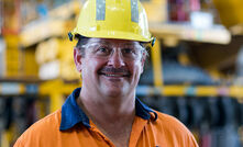 Sean Milful, general manager at BMA's Goonyella Riverside coal mine, in front of one of the new autonomous trucks