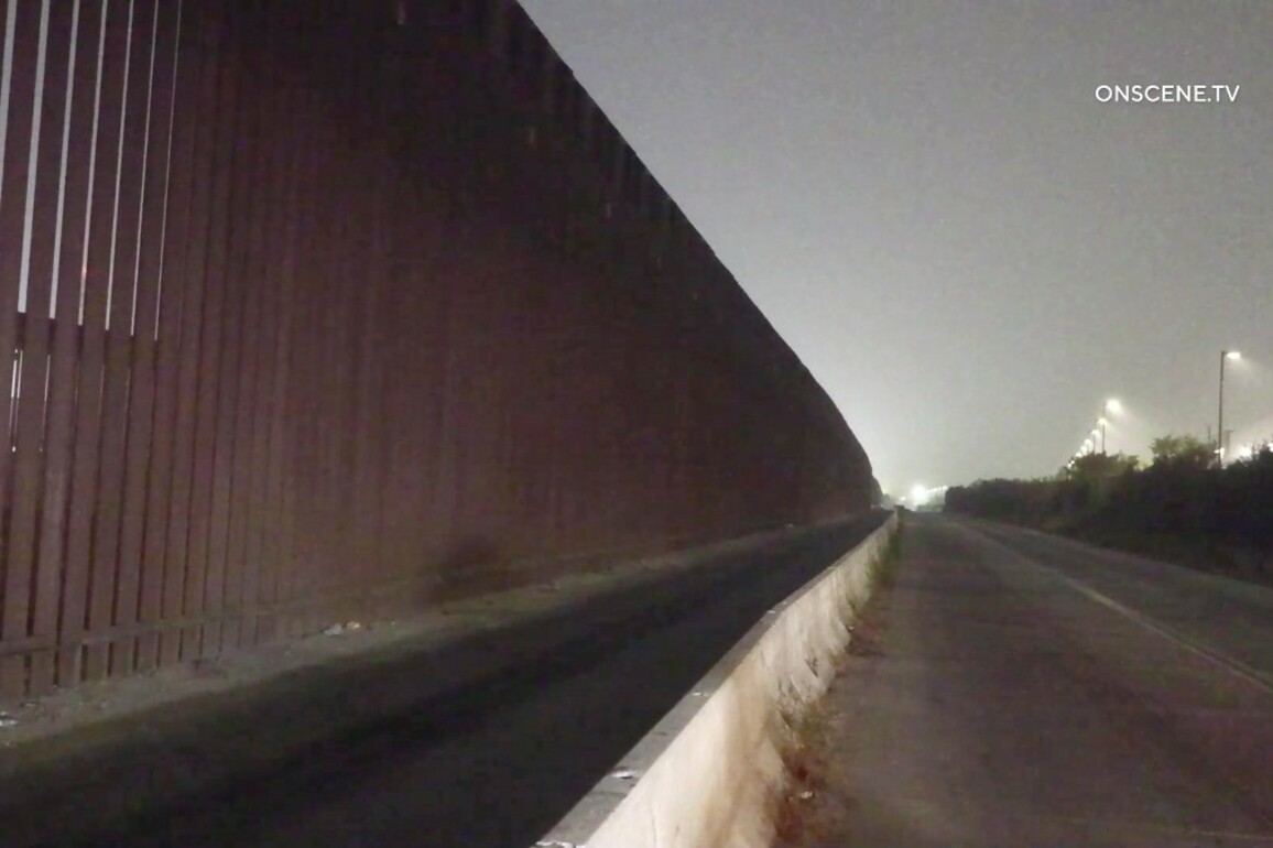 Crews working to rescue man stuck at border wall s of San Diego