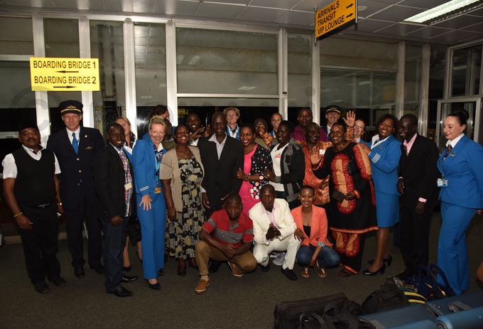 he farmers pose with the  crew at ntebbe irport before the flight hoto by ichard anya