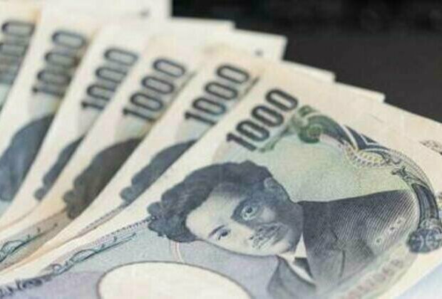 Japanese yen slides to record low