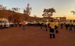  BHP workers social distancing during a pre-start meeting