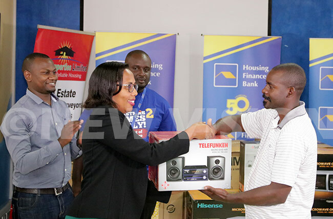  eace abunga hands over a home theatre to a lucky winner