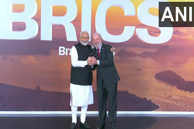 PM Modi shakes hands, shares hug with Brazil Prez, as he arrives for 17th BRICS Summit