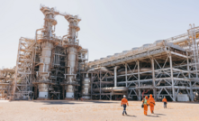 Unions demand higher wages for construction workers. Pictured Woodside's Pluto LNG plant. 