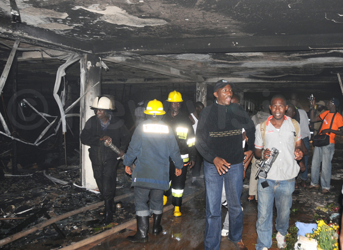 aweesi visits the scene of a fire outbreak at a ata store at apital hoppers in tinda in ecember 2012 hoto by ubiru akebe