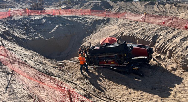 A 10ft by 10ft entry pit with a 2% grade down was dug to allow an 8in bore to be pulled 20ft under a bridge over Deep Creek
