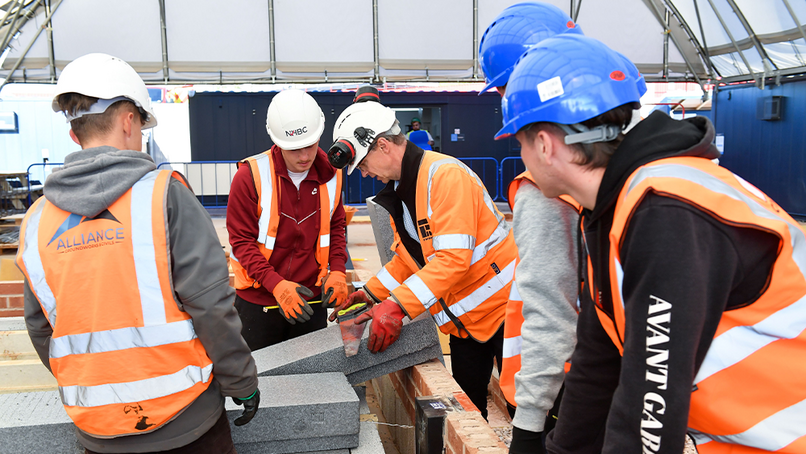 Forterra’s John Cotton demonstrating correct installation to apprentices.