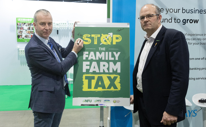 RABDF chair Robert Craig and NFU president Tom Bradshaw sign the campaign pledge at Dairy-Tech