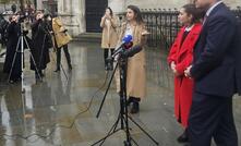 Caroline Narvaz Leite and Tom Ainsworth, from Pogust Goodhead, speak outside the High Court, London on Friday.