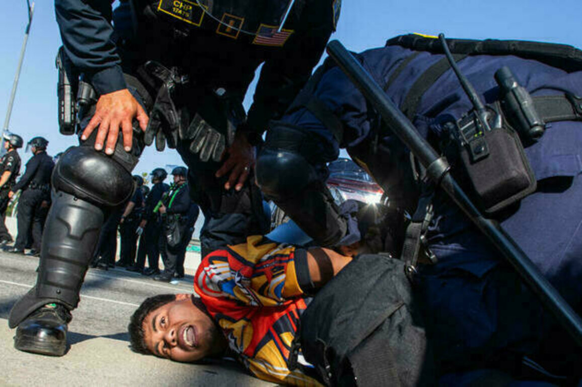 'Mass arrests' underway as LA police enforce overnight curfew