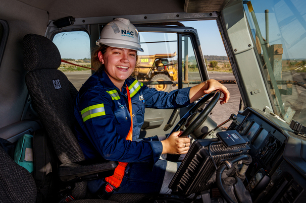 Ella Graham behind the wheel of a Cat haul truck at New Acland. Credit: New Hope Group