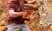 An exploration geologist uses ASD's TerraSpec Halo in the field