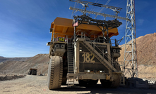 A T 284 truck under the new trolley line at Collahuasi mine in Chile. 