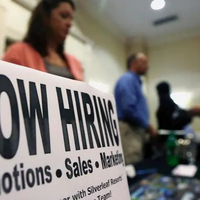 Layoffs jump, resignations drop as US job market loses momentum