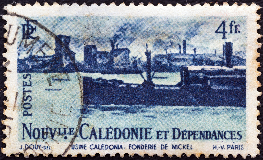 NEW CALEDONIA - CIRCA 1948: A stamp printed in France shows Nickel foundry and ship.