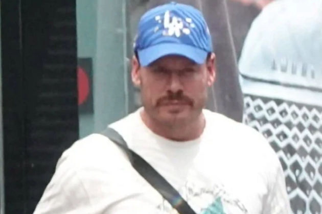 Wanted Canadian ex-athlete now accused in murder of federal witness