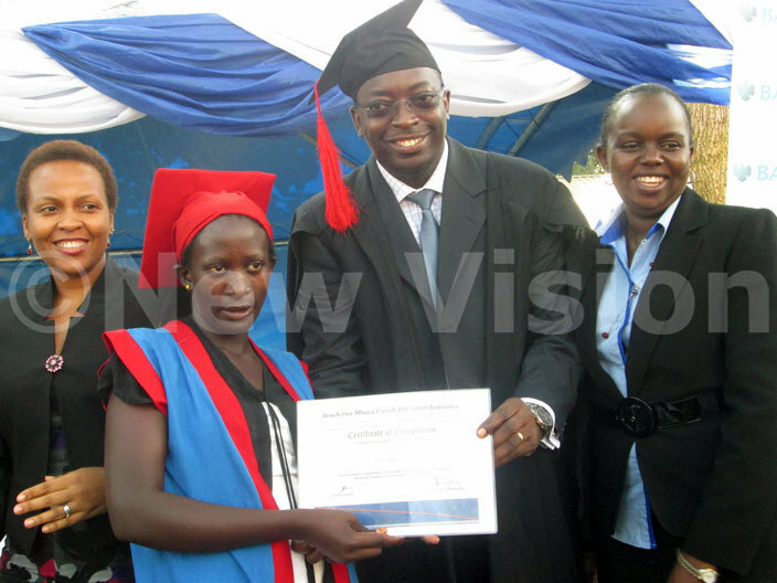 arclays anks ichael egwaya hands a certificate to esty ansubuga icture by athias azinga