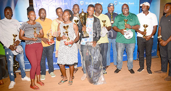  he different winners pose with their trophies at alm alley lub