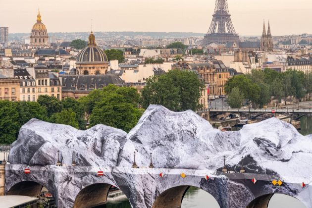 Paris’ oldest bridge wrapped in giant inflatable ‘cave’ by artist