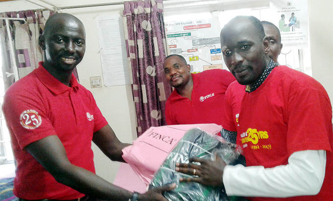 nyutta handing over items to r dward awejje of amwokya hristian aring ommunity as part of the banks corporate social responsibility recently